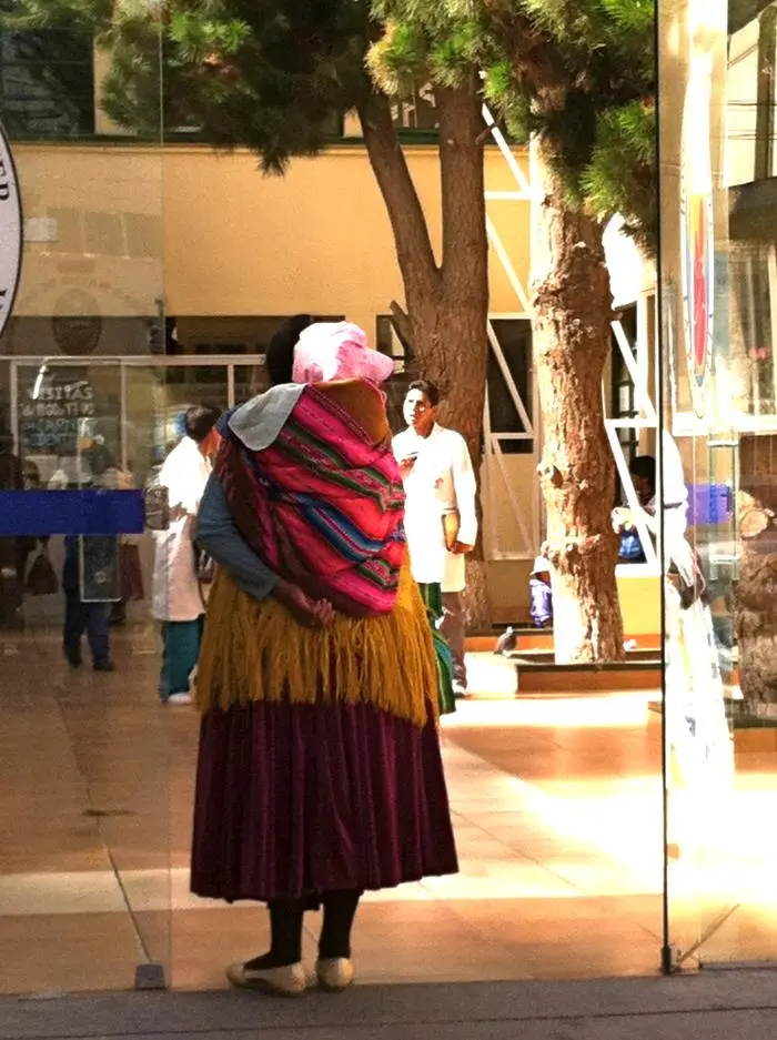 A woman entering a hospital in La Paz, Bolivia, during a cervical screening capacity initiative