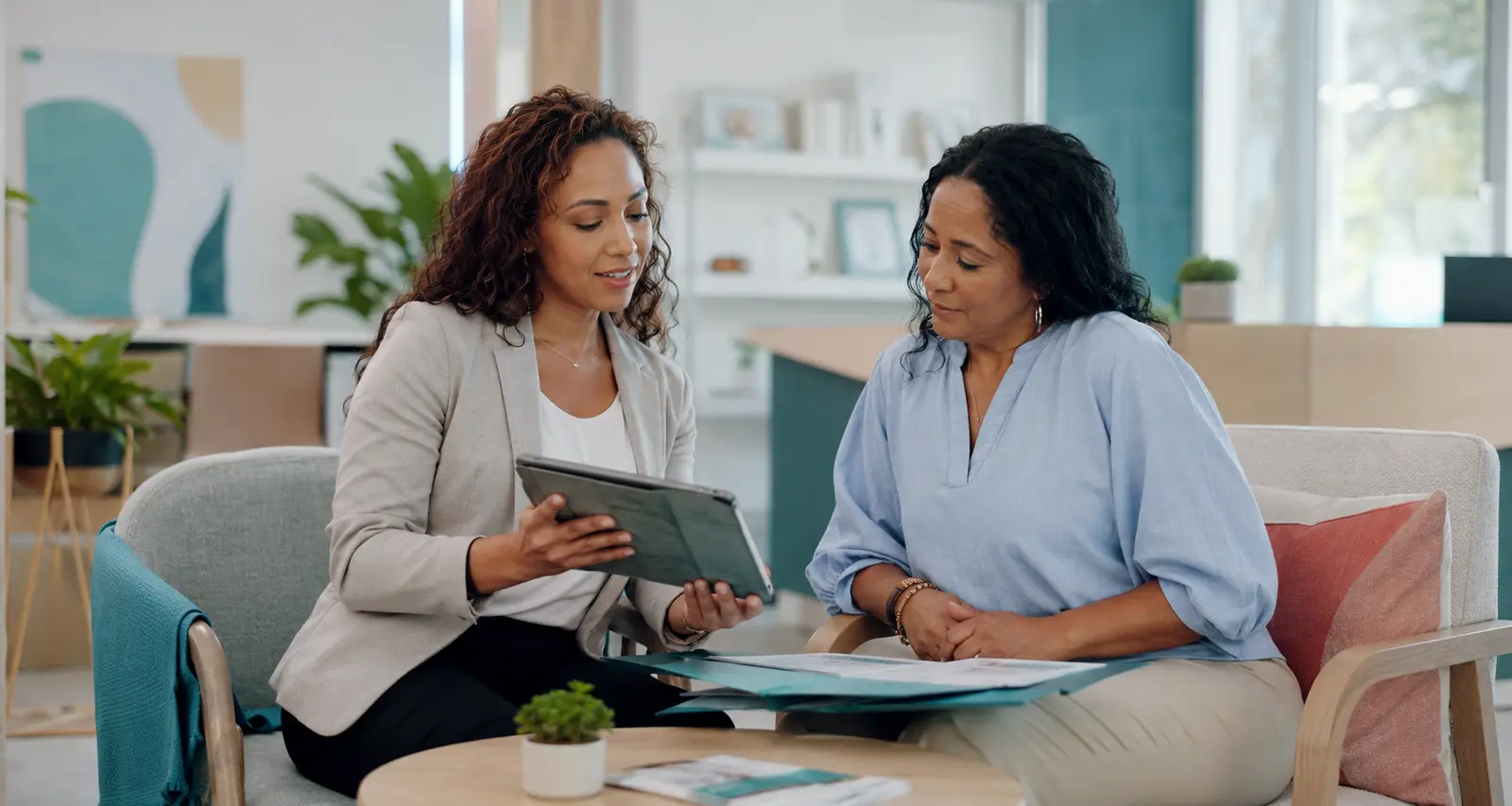 A patient navigator and patient reviewing preventive-care next steps together