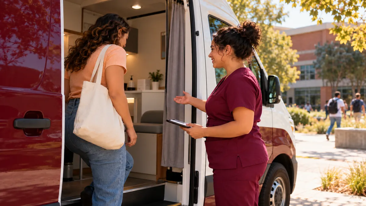 A nurse welcomes an adult into a mobile testing van parked near a community college for confidential testing.